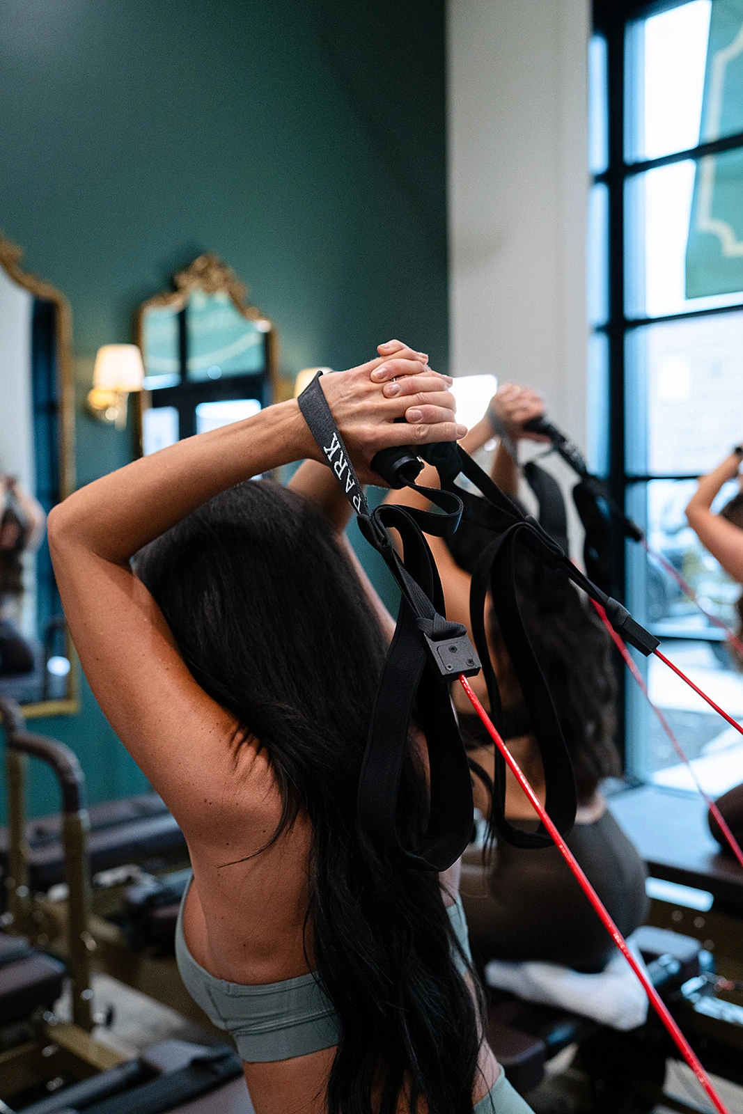 Athletic reformer pose at The Park Pilates